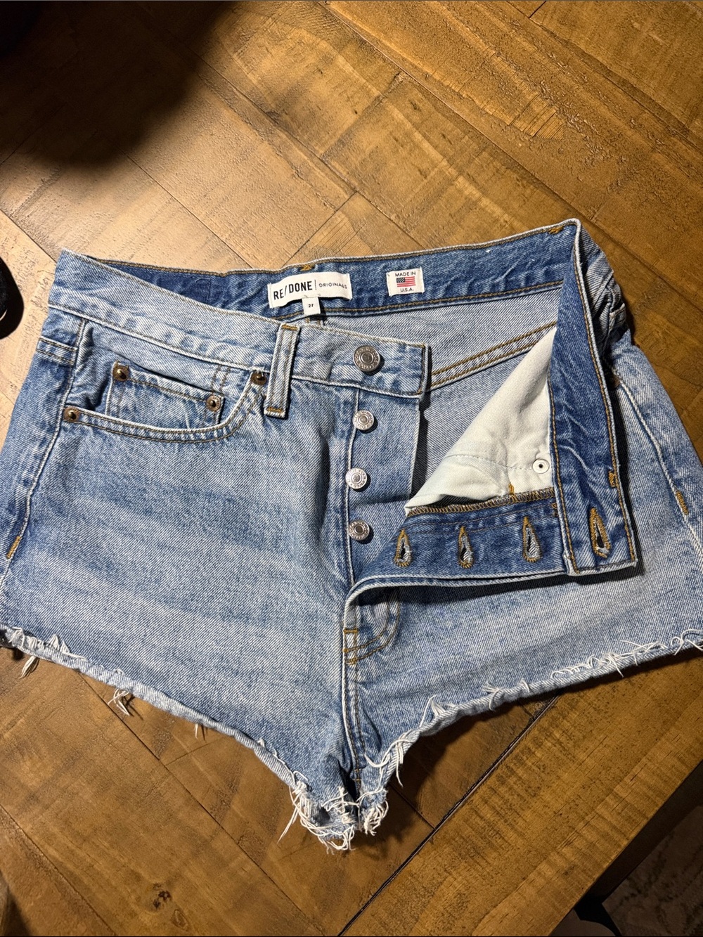 Re/Done Faded Light Blue High-Rise Cutoff Denim Shorts